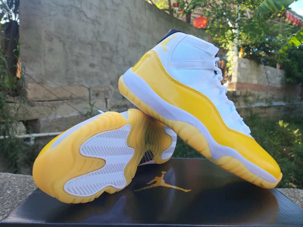 Air Jordan 11 White and Yellow Sneakers