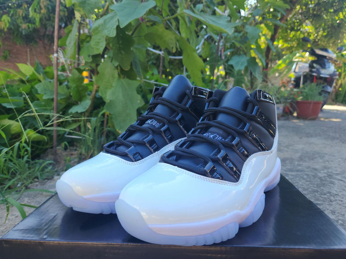 Air Jordan 11 White and Black Sneakers