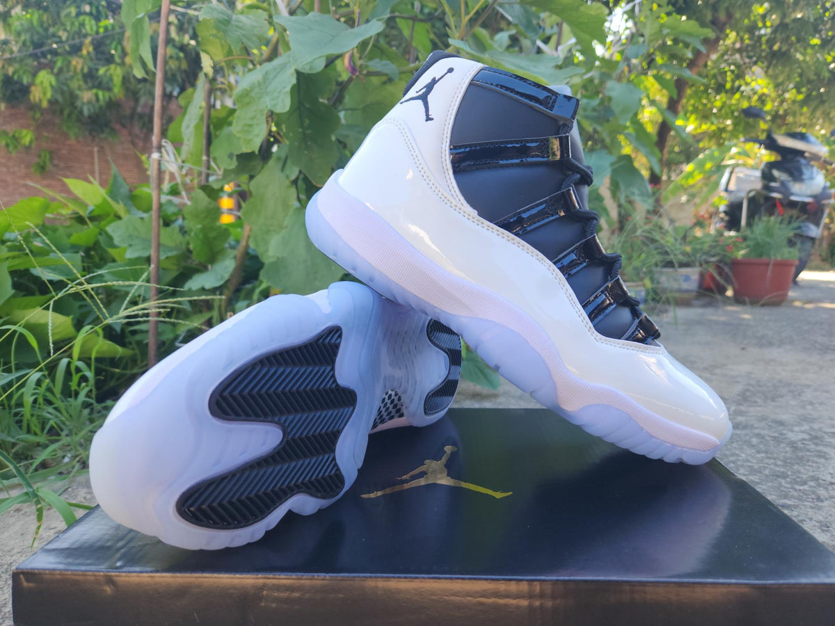 Air Jordan 11 White and Black Sneakers