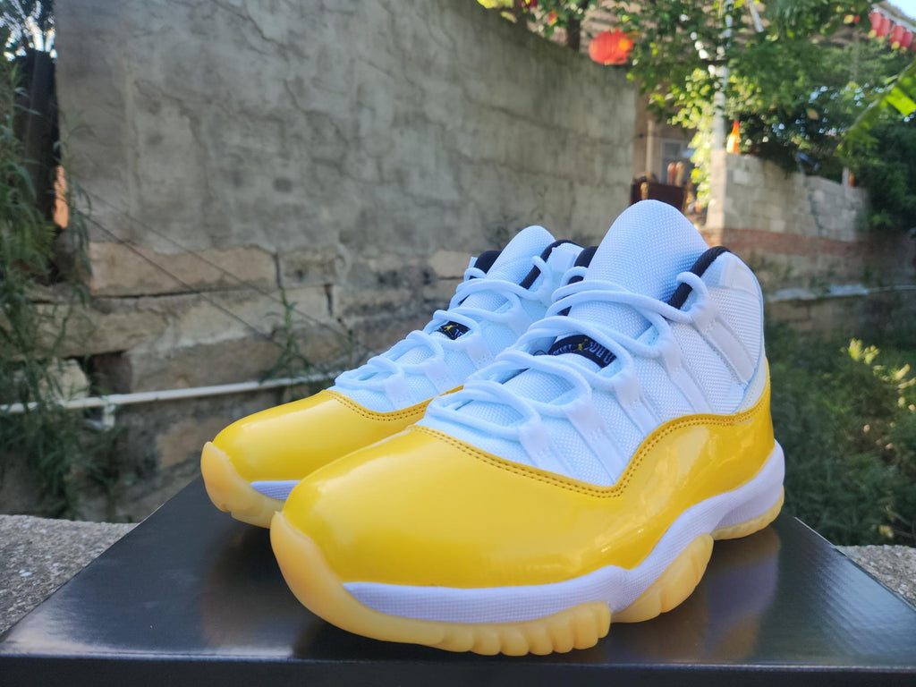 Air Jordan 11 White and Yellow Sneakers