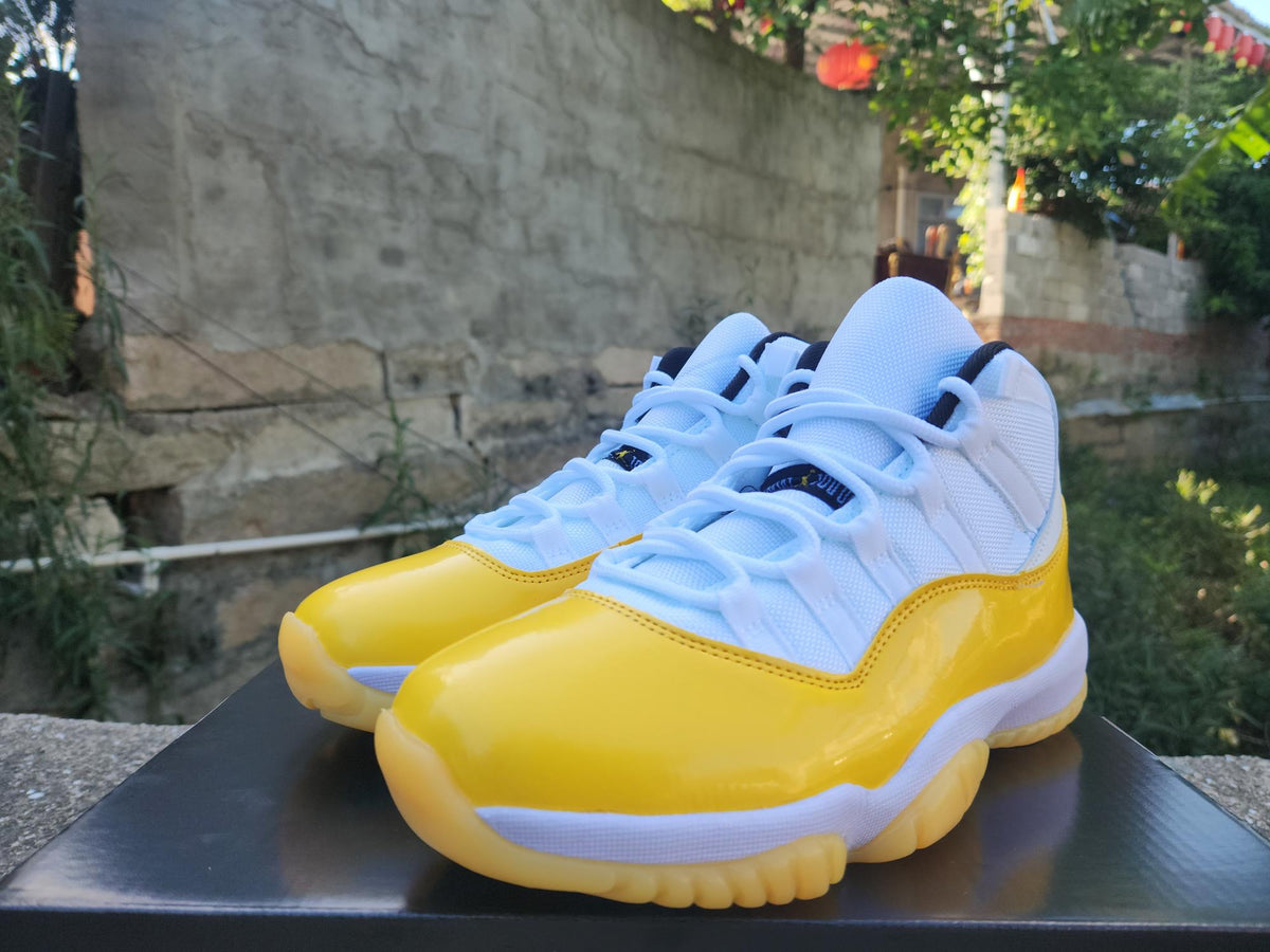 Air Jordan 11 White and Yellow Sneakers