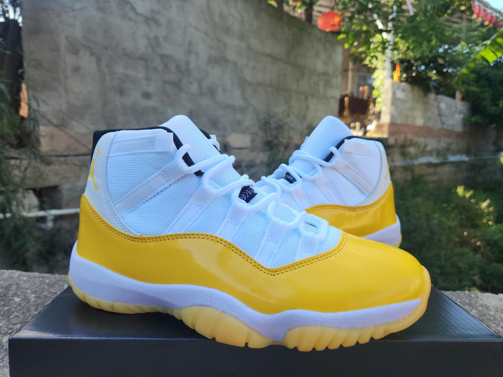 Air Jordan 11 White and Yellow Sneakers
