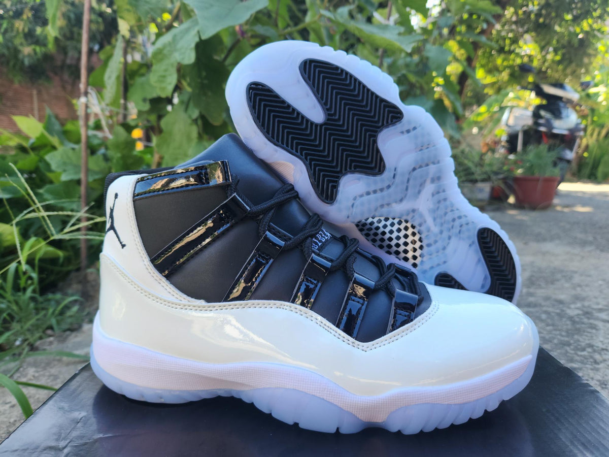 Air Jordan 11 White and Black Sneakers
